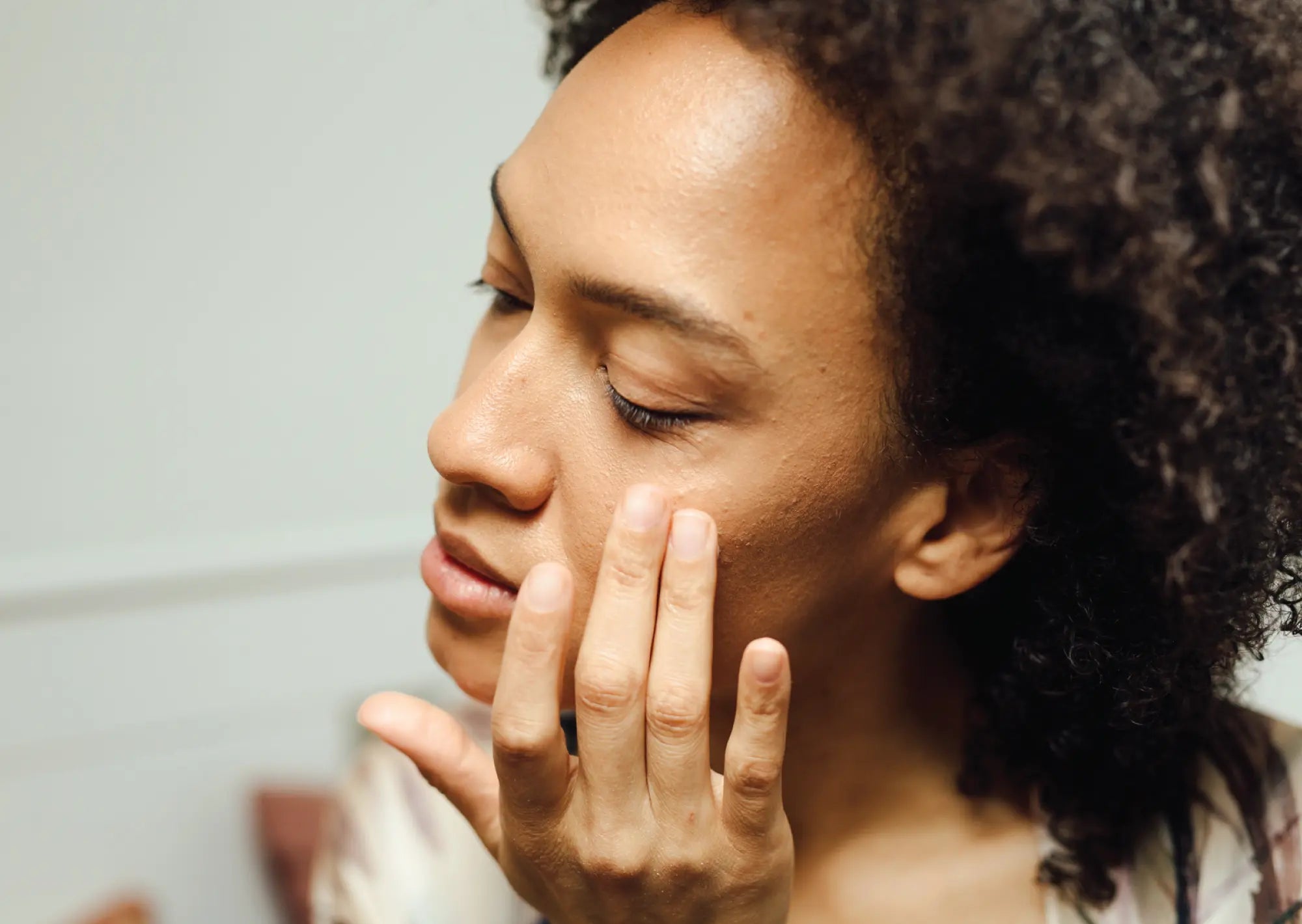 Woman applying skincare